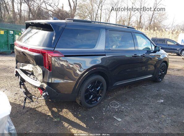 KNDNE5K34T6588093 2026 KIA CARNIVAL MPV Черный Вид задней части салона