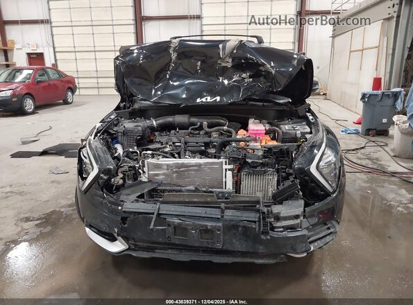 KNDPVCAG9P7098198 2023 KIA SPORTAGE HYBRID Black Rear interior view