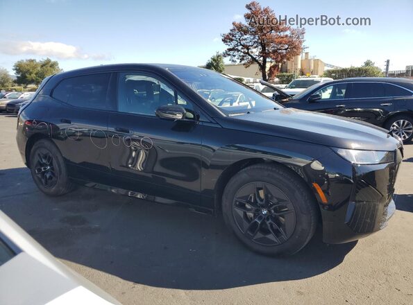 WB543CF09TCV29561 2026 BMW IX Black Передня права чверть