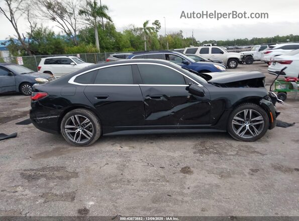 WBA73AV02PFN97418 2023 BMW 4 SERIES Black Widok wnętrza z tyłu