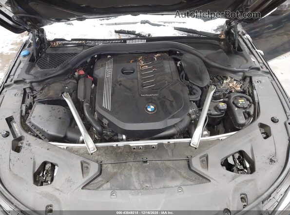 WBAGV4C09MCF63717 2021 BMW 8 SERIES Синий Вид сзади