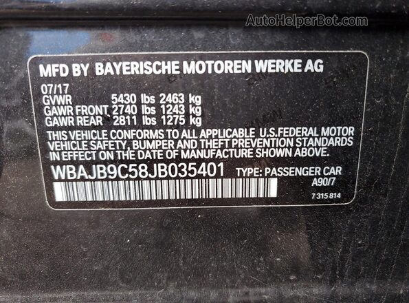 WBAJB9C58JB035401 2018 BMW M5 Charcoal Vista del compartimento del motor