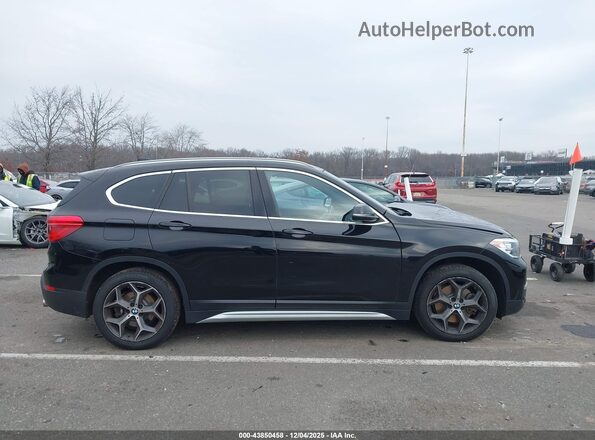 WBXHT3C52K5L37748 2019 BMW X1 Black Vista interior trasera