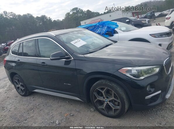 WBXHT3Z39G4A51238 2016 BMW X1 Black Widok wnętrza z tyłu
