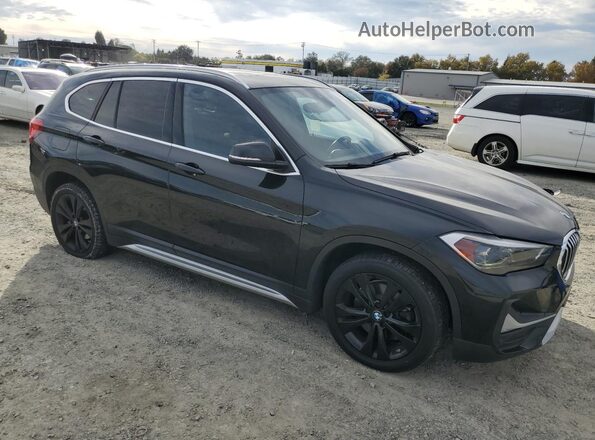 WBXJG9C03L3L24369 2020 BMW X1 Black Front right