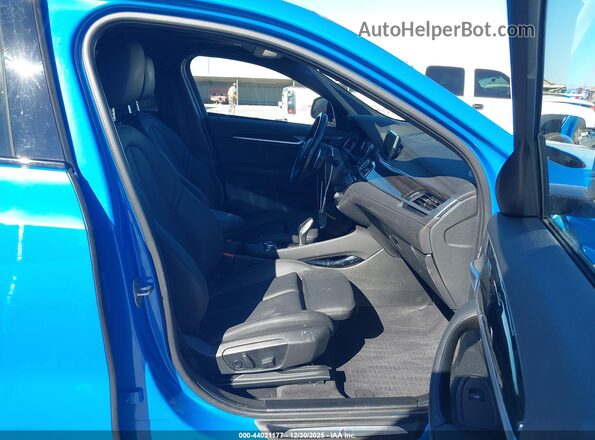 WBXYH9C04P5V31469 2023 BMW X2 Blue Vista interior delantera