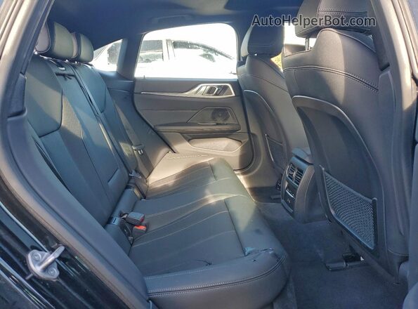 WBY43AW06RFT07316 2024 BMW I4 Black Вид задніх сидінь