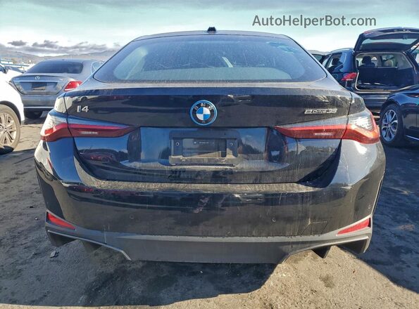 WBY43AW06RFT07316 2024 BMW I4 Black Вид ззаду
