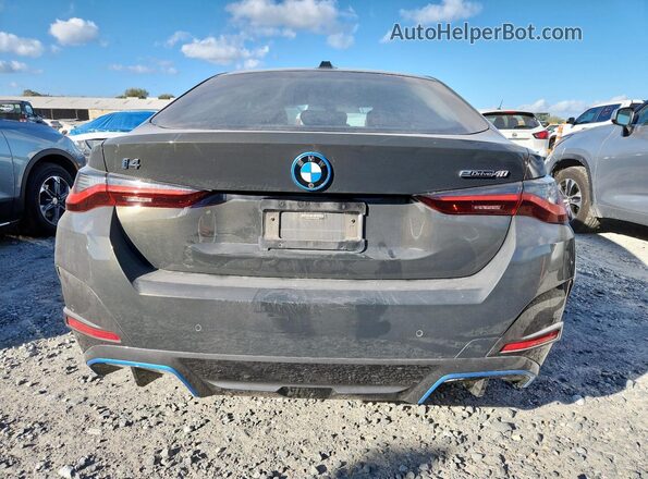 WBY73AW04PFN92589 2023 BMW I4 Charcoal Rear view