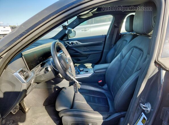 WBY73AW04PFN92589 2023 BMW I4 Charcoal Front interior view