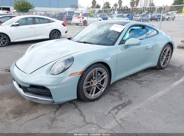 WP0AA2A92SS206521 2025 PORSCHE 911 Бирюзовый Передняя левая четверть