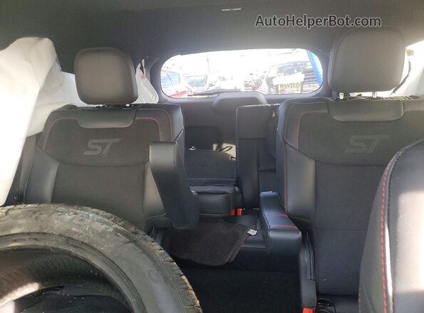 1FMWK8GC4TGA34212 2026 FORD FORD EXPLORER Red Rear seats view