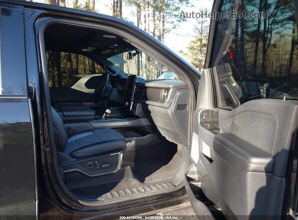 1FT6W1EV8PWG33372 2023 FORD F-150 LIGHTNING Black Front interior view