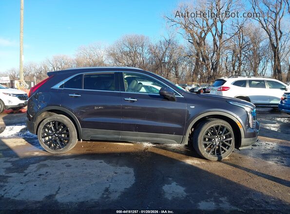 1GYFZBR4XNF146776 2022 CADILLAC XT4 Gray Vista interior trasera