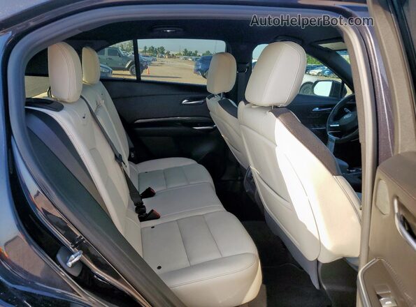 1GYFZER45PF105055 2023 CADILLAC XT4 Black Սալոնի հետևի տեսք