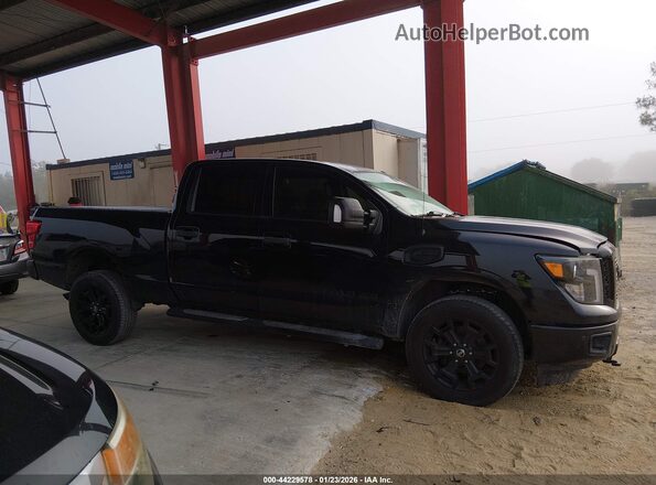 1N6BA1F49KN516592 2019 NISSAN TITAN XD Black Սալոնի հետևի տեսք