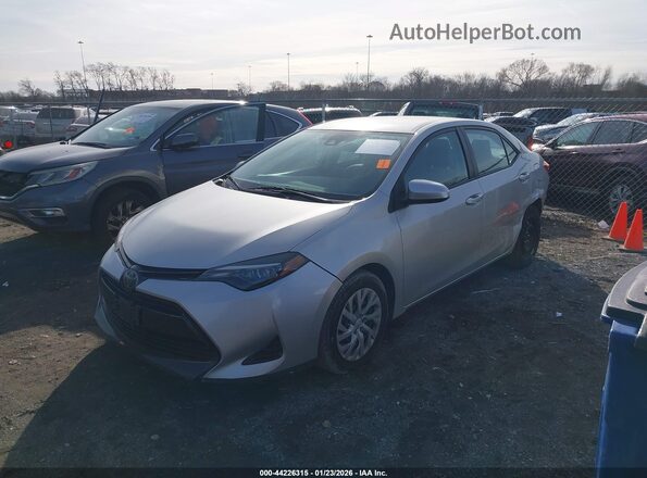 2T1BURHEXKC126747 2019 TOYOTA LL Серебряный Передняя левая четверть