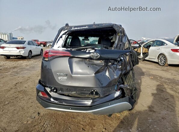2T3JFREVXGW457755 2016 TOYOTA RAV4 Gray Rear view