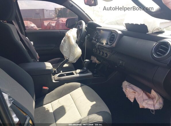 3TMCZ5AN1PM586029 2023 TOYOTA TACOMA Black Front interior view