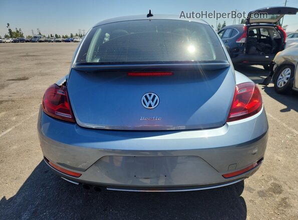 3VWFD7AT2KM703970 2019 VOLKSWAGEN BEETLE Silver უკანა ხედი