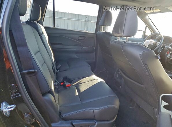5FNYF8H52PB037885 2023 HONDA PASSPORT Черный Вид задней части салона