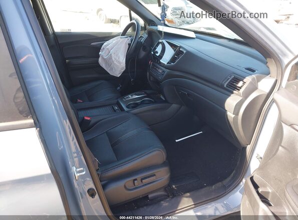 5FNYF8H68PB021277 2023 HONDA PASSPORT Blue Widok wnętrza z przodu