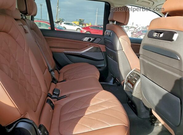 5UX23EM09R9T49222 2024 BMW X7 Tan Rear interior view