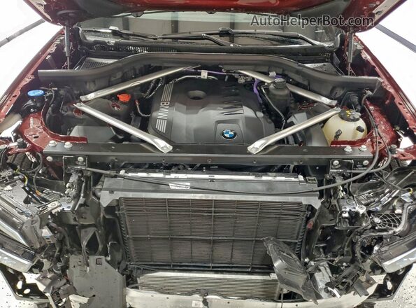 5UX23EM09T9065614 2026 BMW X7 Burgundy VIN კოდის სტიკერის ხედი