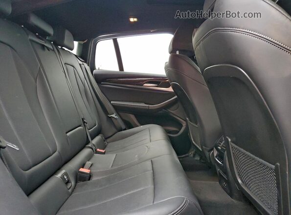 5UX33DT07R9V04043 2024 BMW X4 Black Vista interior trasera