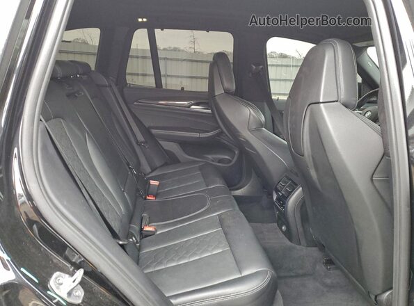 5YMTS0C00L9B63552 2020 BMW X3 Black Widok wnętrza z tyłu