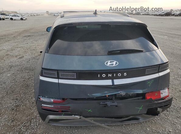 7YAKN4DA1SY035969 2025 HYUNDAI IONIQ Gray Widok z tyłu