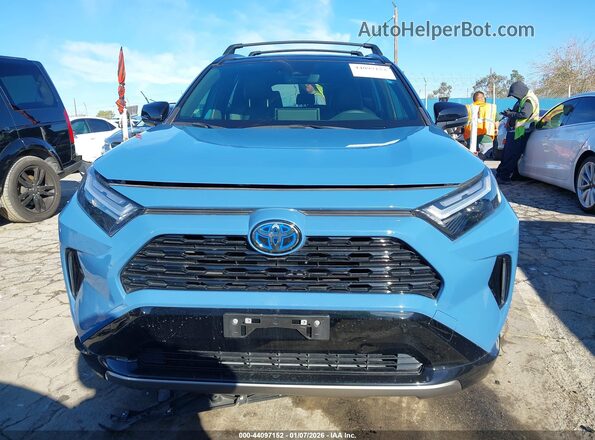 JTME6RFV9ND528633 2022 TOYOTA RAV4 HYBRID Blue Vista interior trasera