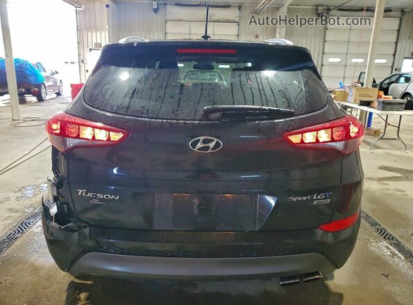 KM8J3CA22GU075438 2016 HYUNDAI TUCSON Black Widok z tyłu