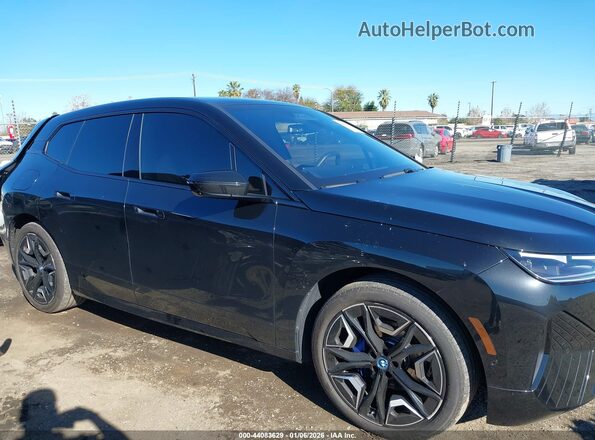 WB523CF03SCT07734 2025 BMW IX Black Rear interior view