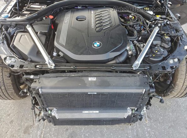 WBA53AT06MCG37011 2021 BMW M4 Black Widok wnętrza z tyłu