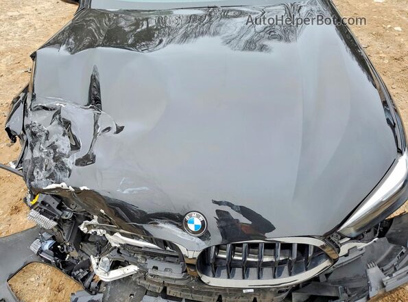 WBAGV8C04NCH67611 2022 BMW M8 Black Vista interior trasera