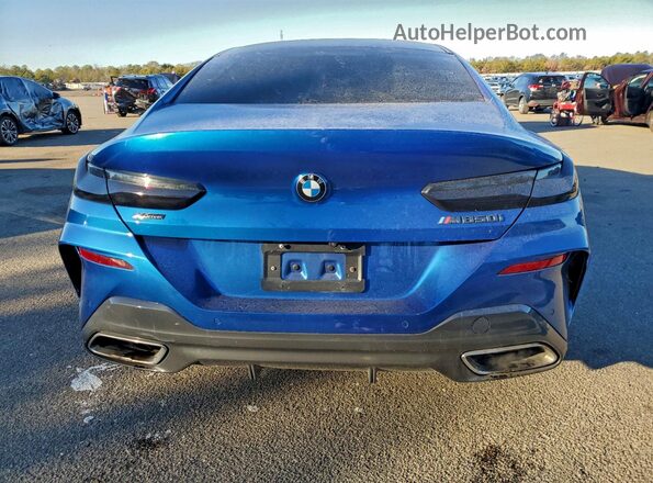WBAGV8C07LCE44957 2020 BMW M8 Blue Vista trasera