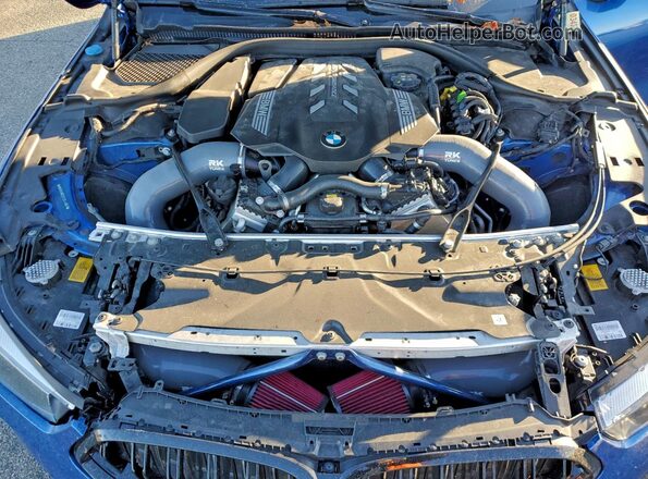WBAGV8C07LCE44957 2020 BMW M8 Blue Vista interior trasera