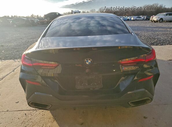 WBAGV8C09LCD81814 2020 BMW M8 Black Widok z tyłu