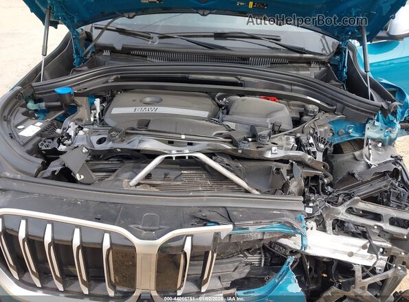 WBX73EF00P5X97067 2023 BMW X1 Teal Вид ззаду