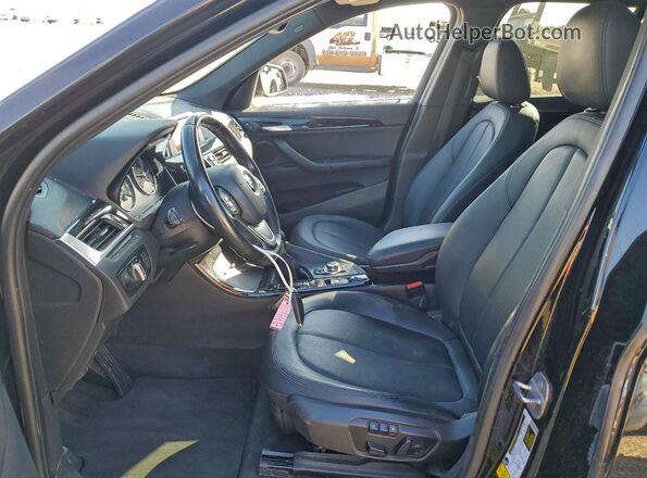 WBXHT3C30GP881823 2016 BMW X1 Black Vista interior delantera