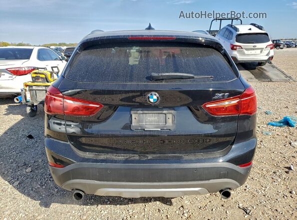 WBXHT3C30GP881823 2016 BMW X1 Black Vista trasera