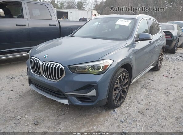 WBXJG7C07L3L85650 2020 BMW X1 Gray Առջևի ձախ երեք քառորդ տեսարան