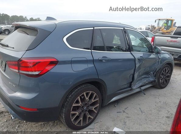 WBXJG7C07L3L85650 2020 BMW X1 Gray Սալոնի հետևի տեսք