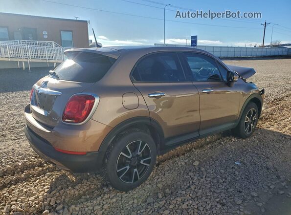 ZFBCFYAB4HP610919 2017 FIAT 500X Желто-коричневый 