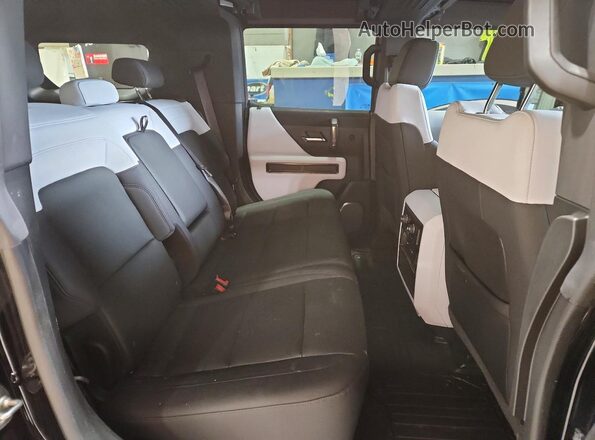 1GKB0NDEXRU106655 2024 GMC HUMMER Черный Вид задней части салона