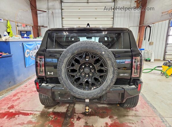 1GKB0NDEXRU106655 2024 GMC HUMMER Черный Вид сзади