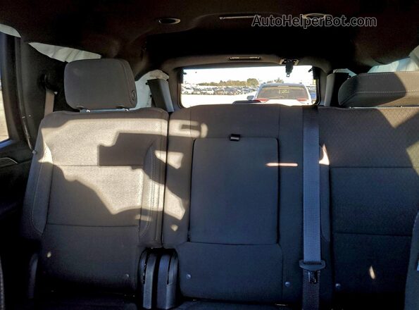 1GNSCMKD0RR366144 2024 CHEVROLET TAHOE Red Вид задніх сидінь