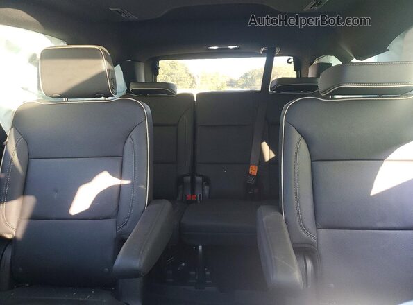 1GNSCSKDXRR396465 2024 CHEVROLET TAHOE Silver Rear seats view