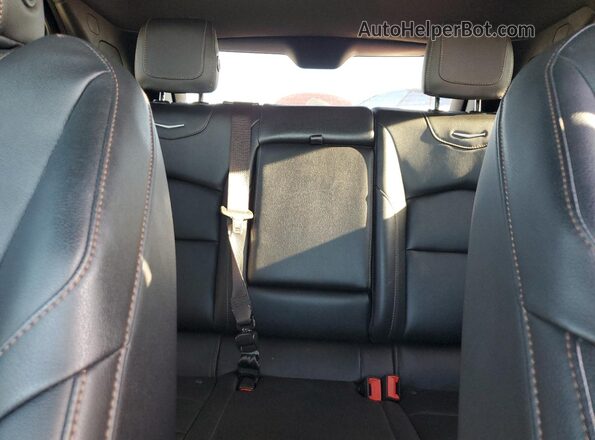 1GYFZER47PF100682 2023 CADILLAC XT4 Black Vista de los asientos traseros